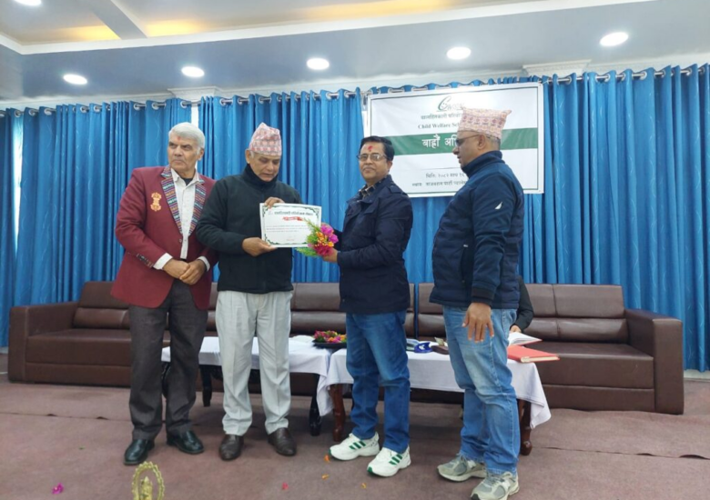 An individual handing over a certificate to the newly elected Chairperson.